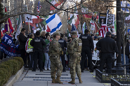 Demonstrators hold flags during a rally in support of regime change in Iran near the White House. U.S. President Donald Trump said the United States may consider striking additional areas and groups in Iran that were not previously targeted, signaling a potential escalation in the week-long conflict that has disrupted energy markets and drawn global attention.