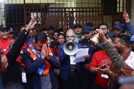 Rastriya Swatantra Party (RSP) candidate Biraj Bhakta Shrestha gestures to supporters after winning a second term in parliament from Kathmandu-8 in the House of Representatives election.