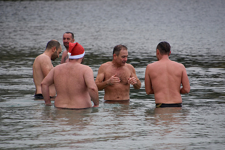 Men are seen during their first sea bath of the year at one of the Corbières Beaches in Marseille.As every year, courageous people met at the Corbières Beaches in Marseille to take part in the traditional first sea bath of the year.