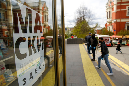 Face masks sign hangs on a door of a shop at Chernaya rechka subway station during the covid 19 pandemic.Since 12 May in Saint-Petersburg wearing face masks and gloves to prevent spread of coronavirus is a must. Russia becomes second hardest-hit country with atlist 232243 confirmed cases of coronavirus.