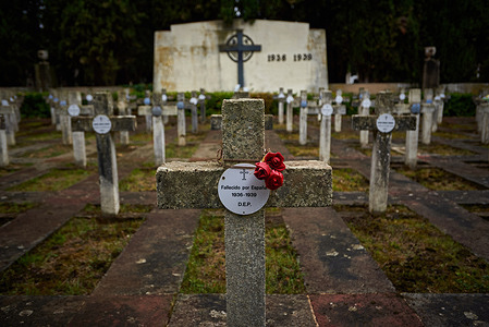 A cross with a sign reading: "Deceased by Spain" is seen at the cemetery of those who were killed during the Spanish Civil War at the Spanish Berichitos Cemetery.
On the occasion of All Saints' Day, catholic families go to the Spanish Berichitos Cemetery in Pamplona to lay flowers on the graves of their deceased relatives in Navarra.