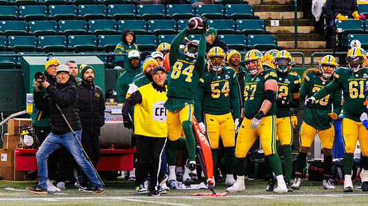 Edmonton Elk's (84) Odieu Hiliare catches a pass just in front of the Edmonton Bench during a game between CFL Edmonton and Winnipeg at Commonwealth Stadium. Edmonton Elks defeats the Winnipeg Blue Bombers to CFL Season regular season action 25-20.