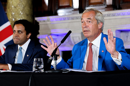 Reform UK leader Nigel Farage (R) and Reform UK home affairs spokesperson Zia Yusuf (L) seen during the launch of Operation Fortress at the party' s press conference.