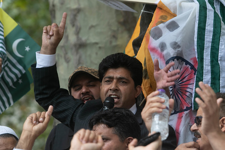A Pro Kashmir protester addresses in front of the statue of Gandhi in Parliament Square in solidarity with the people of Kashmir after Indian Prime Minister Narendra Modi delivered an Independence Day speech to remove the special rights of Kashmir as an autonomous region.