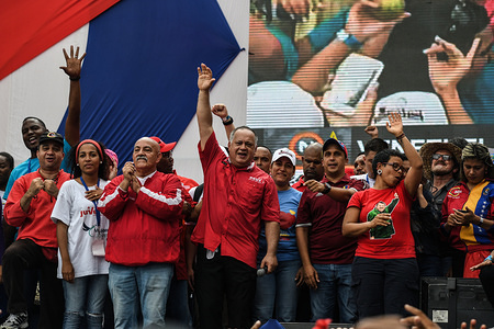 Diosdado Cabello alongside party members seen raising their arms during the rally.
March called by the vice president of the United Socialist Party of Venezuela (PSUV), Diosdado Cabello, against the accusations and investigations made by the US government to political leaders of President Maduro's administration.