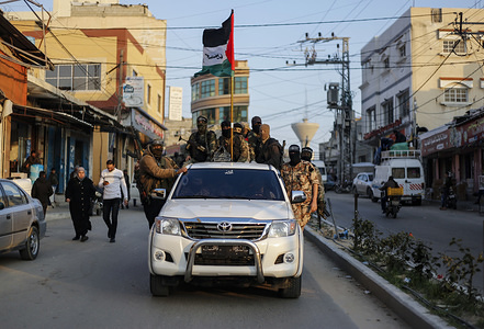Palestinian activists from the Nasser Salah El-Din Brigade take part during an anti-Israel demonstration in Khan Yunis.
Al-Nasser Salah Al-Din Brigades hold an anti-Israel military parade, southern Gaza Strip as part of the second anniversary of an operation called "Ambush Al-Alam carried out in Khan Yunis.