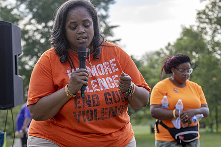 Malissa Thomas, St. Clair, a member of Mothers of Murdered Columbus Children, ends the rally against violence with a prayer and asks if anyone would like to receive Jesus. 
Mothers of Murdered Columbus Children held a rally and press conference at Bicentennial Park to address the rise in violence in Columbus over the past few years. This event was in direct reaction to the shooting that caused the death of 16 year old Olivia Kurtz and wounded 5 other individuals in Bicentennial Park.
