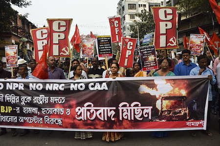 Protesters march with banners and placards during the demonstration.
Left front party takes out a protest rally in Kolkata against communal violence happening in Delhi.