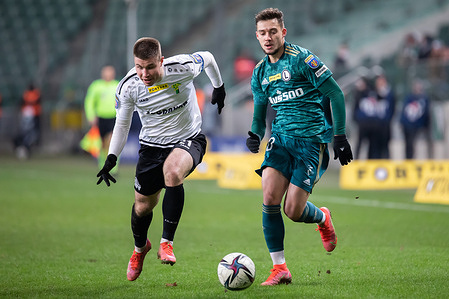 Kryspin Szczesniak of Gornik and Ernest Muci of Legia in action during the Fortuna Polish Cup quarter-final match between Legia Warszawa and Gornik Leczna at Marshal Jozef Pilsudski Legia Warsaw Municipal Stadium.
 (Final score; Legia Warszawa 2:0 Gornik Leczna).