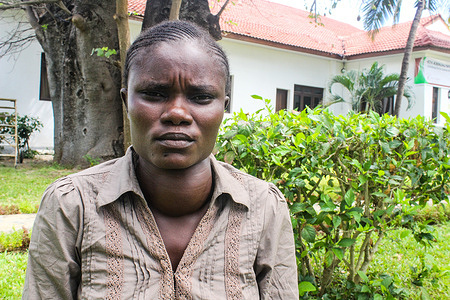 Irine Akinyi, 28 year old, a victim of lead poisoning in Uwino Uhuru Village of Changamwe seen after an interview with the press. She suffers from kidney and thyroid problems as a result of exposure to lead poisoning from a lead battery smelting company in her neighborhood. The company has so far been shut down but the damage left behind has been deadly. In a Landmark ruling earlier this year, the government and the two private investors were ordered to pay the victims a ksh 1.3 billion equivalent to 12 million USD as compensation, a matter the government through the attorney general has appealed.