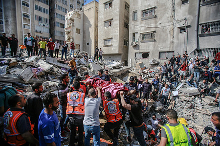 (EDITORS' NOTE : Image depicts death)Palestinian civil defense extract a body of a Palestinian man who was killed during an Israeli airstrike.A total of 174 people have been killed in Israeli raids on Gaza, including 47 children and 29 women, the Palestinian ministry of health said on Sunday. In response to the violent confrontations between Israeli security forces and Palestinians in Jerusalem, various Palestinian militant factions in Gaza launched rocket attacks on Israel since 10 may, resulting in retaliatory strikes by Israel on Gaza strip.