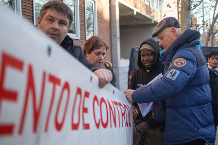 A group of protesters carries a banner during a fishermen's rally. Spanish fishermen in Madrid, called by the National Federation of Fishermen's Associations (FNCP), to protest against the European Union's new control regulations.
