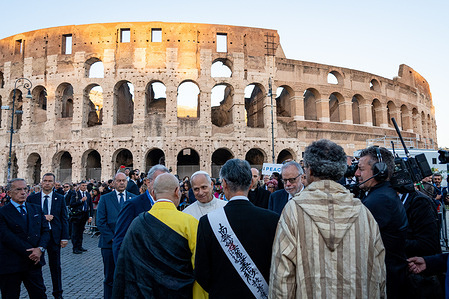 Pope Leo XIV greets representatives of other religions outside the Colosseum after the inter-religious meeting to pray for peace inside the Colosseum in Rome,.
