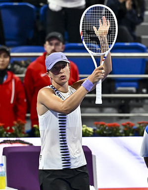 Iga Swiatek of Poland celebrates after winning against Daria Kasatkina of Australia (not in view) during their round of 16 match at the WTA Qatar TotalEnergies Open 2026 tennis tournament at the Khalifa International Tennis Complex. Iga Swiatek won against Daria Kasatkina 5-7,6-1,6-1
  