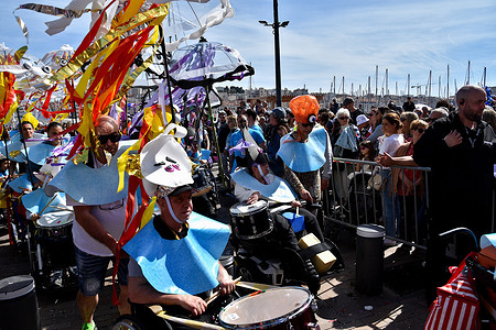 A group of disguised musicians performs during the carnival. The parade of The Marseille Carnival was held at the Old Port of Marseille on May 6, where hundreds of people gather to witness and enjoy the event.