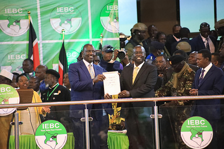 Kenya's president-elect William Samoei Ruto from United Democratic Alliance (UDA) and his running mate Rigathe Gachagua display their certificate after winning the 2022 Kenya presidential elections. The new set of national executives in Kenya is announced at the IEBC's tallying center in Bomas of Kenya. The IEBC chairman Wafula Chebukati declared deputy president William Ruto as the new president of Kenya, with 7.18 million votes compared to his competitor Raila Odinga with 6.9 million votes.