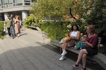 Pedestrians are seen on the High Line during a heat wave in Manhattan, New York City. Millions of people in the northeast region of the United States are experiencing high temperatures this week with humid weather reaching above 90 degrees Fahrenheit. Weather advisories have urged people to stay cool and hydrated amid the hot weather.