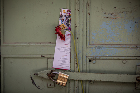 A flower and a leaflet from Tag Meir activists are seen on the lock of a closed Palestinian shop in Jerusalem's walled Old City, Israeli nationalists, many of them teenagers and young adults, swept through the narrow streets of Jerusalem's Old City during the annual Jerusalem Day march, chanting Death to Arabs and May your villages burn as tens of thousands paraded to celebrate what Israeli authorities call the reunification of Jerusalem following Israel's capture and annexation of east Jerusalem in the 1967 Arab-Israeli war, while many Palestinian residents remained barricaded indoors and shopkeepers were forced, ostensibly for their own protection, to close their businesses.