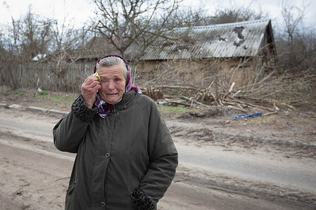 An elderly woman cries near her destroyed house after the Ukrainian army liberated her village from Russian occupiers in the village of Shevchenkove in Kyiv region. Many towns and villages in the Kyiv region became battlefields and were subjected to heavy artillery shelling when the Russian army tried to break into Kyiv in the spring of 2022.