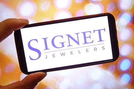 In this photo illustration, the Signet Jewelers company logo is seen displayed on a smartphone screen.