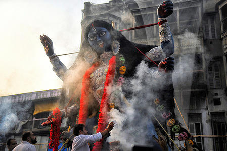 A giant idol of Goddess Kali is transported to a temporary structure of worship called Pandel, ahead of the Kali Puja festival celebration, in Kolkata. Goddess Kali is being worshipped as a saviour from all evil forces, demons and as a source of power and happiness as per Hindu Mythology.