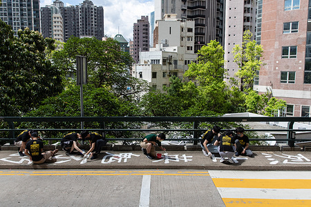 Students from The Hong Kong University Student Union repainting the slogan on June 11, 2021 as a part of tradition to memorize and mourn the victims in June 4, 1989 Massacre in Beijing.
The University of Hong Kong on Saturday, Jan 29 covered up a slogan on a bridge in its campus, which commemorating June 4 Massacre event. Another move after the school removes the Pillar of Shame erected in the school campus. School officials claimed the work is a part of its regular maintenance schedule.