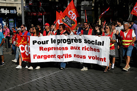 Protesters march through the streets of Marseille holding a banner and flags during the rally. Left-wing parties and some unions joined the "Block Everything" citizens' movement, calling on the government to mobilize and paralyze the country on September 10, 2025, with a series of protest and civil disobedience actions across the country, in response to the French government's austerity policies.