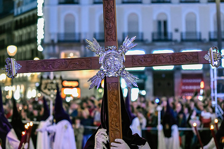 Penitents seen accompanying the Christ, during the Gypsies (Los Gitanos) Procession on Holy Wednesday in Madrid city center.