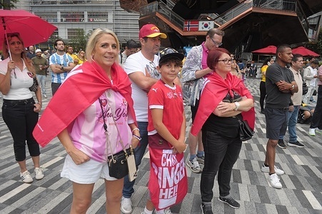 Fans wearing jerseys of the Switzerland national soccer team watch the televised 2026 FIFA World Cup soccer game between Colombia and Switzerland on a big screen in the Backyard at Hudson Yards in Manhattan, New York City.