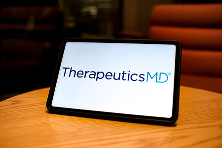 In this photo illustration, the TherapeuticsMD logo is displayed on the screen of a tablet.
