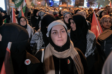 A woman wearing a keffiyeh seen in front of the Israeli consulate during the demonstration. Thousands of pro-Palestinian protesters demonstrated outside the Israeli Consulate in Istanbul's Levent district against Israel's attack on the Sumud Flotilla, which had set sail to break the Gaza blockade.
