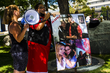 A protester speaks into a bull horn while holding a sign with images of deceased native American woman Georgianna Jackson during the protest.
Protesters gathered in front of a federal court house in Reno to voice their concerns about police killings. They asked for independent investigations to be done where police is involved in fatal incidents.
