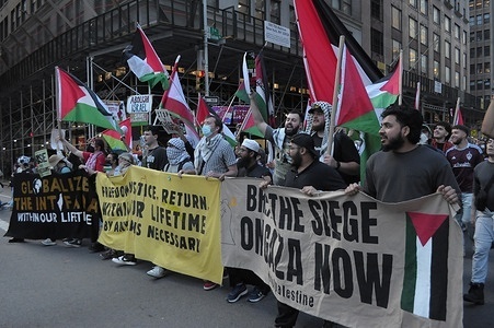 Pro-Palestine demonstrators march holding banners and Palestinian flags on Palestinian Prisoners Day. Pro-Palestine demonstrators rallied in Manhattan, New York City demanding Israel to release Palestinian prisoners from jail. Protesters also condemned Israel’s new death penalty law, which solely targets Palestinians convicted of deadly attacks against Israel.