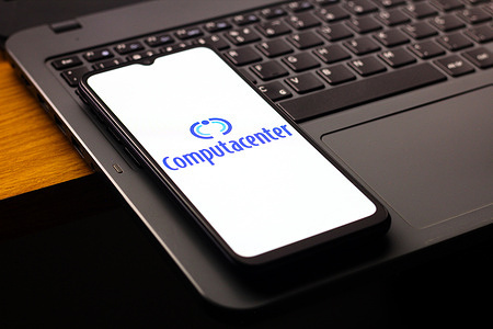 In this photo illustration, the Computacenter logo is seen displayed on a smartphone screen.