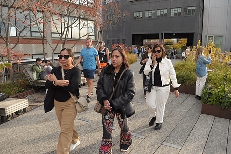 People walk on the High Line in Manhattan, New York City.