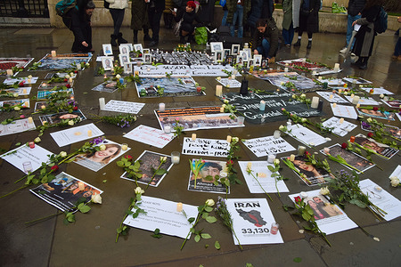 Tributes and photos are seen during a vigil outside the National Gallery in Trafalgar Square for victims of the Iranian Regime and in protest against the Islamic Republic.