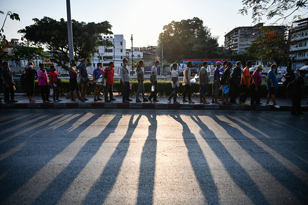 Homeless people wait in a queue to receive free food from the philanthropists outside the Hua Lamphong Railway Station.
Thailand has so far reported 2,423 cases of COVID-19 coronavirus with most of the cases reported in the Capital city Bangkok.