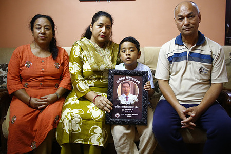 A group photo shows (from left) mother Niru Shrestha, wife Rojita Shrestha, six-year-old son Shreyan Kishor Shrestha holding his father late Sauran Shrestha’s condolence frame, and father Basanta Kishor Shrestha at their home in Dhungedhara. After working five years in South Korea, Sauran returned to Nepal to build a small business and raise his six-year-old son, but his dreams ended on September 8 when he was fatally shot during the Gen Z protest near Parliament. Witnesses said he was helping an injured protester when he was hit by live bullets fired during the youth-led movement against government corruption. His death, which left behind his wife, young son, and grieving parents, became one of 75 lives lost in the protest.