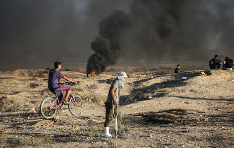 A wounded Palestinian man is seen among protesters.
A demonstration by the Palestinian citizens along the border with the Gaza strip east of Gaza city.