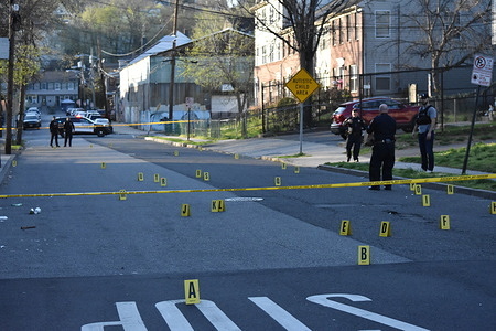 Evidence markers and bullets on the street. The shooting occurred outside 41-45 Arch Street in Paterson, Wednesday afternoon. No further information was immediately available on any possible victims, several evidence markers and bullets filled the street.