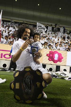 Akram Afif of Al Sadd SC poses with the Qatar Stars League trophy after winning the Doha Bank Qatar Stars League final match between Al Sadd SC and Al-Shamal SC at Jassim Bin Hamad Stadium. Final score; l Sadd SC 3 : 2 Al-Shamal SC.