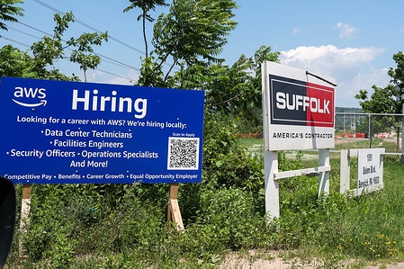 Signs are seen at a construction entrance to an Amazon Web Services' (AWS) hyperscale data center campus being built adjacent to Talen Energy's Susquehanna nuclear power plant.