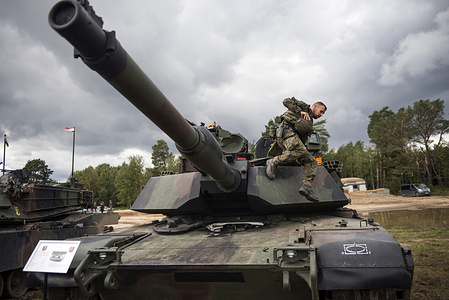 A Polish Army US-made Abrams tank seen during military exercises of Poland and NATO allied countries. Poland and NATO allies held military exercises at a training ground as part of Iron Defender-25 (Żelazny Obrońca-25), the largest and most significant planned event for the Polish Armed Forces. The drills involve land, air, and sea operations conducted by the Land Forces, Air Force, Navy, Special Forces, and Territorial Defense Forces. Around 30,000 soldiers and 600 pieces of equipment are taking part. The exercise aims to test interoperability and readiness for defensive operations in a multi-domain environment. Officials emphasize the drills are defensive but note they coincide with Zapad-25, large-scale Russian-Belarusian war games happening at the same time.