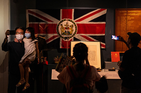 Father and daughter take a selfie next to a colonial Hong Kong flag at the exhibition.
The “Hong Kong Story” permanent exhibition located at the Hong Kong Museum of History will be closed later this month due to an extensive revamp.