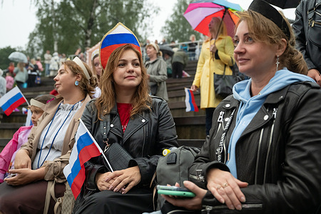 Women take part in setting a Russian record for the largest number of women wearing the traditional headdress “kokoshnik” during an event at the City Day celebration in Vsevolozhsk.
