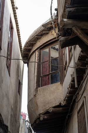 Architectural detail of a traditional Syrian Arabic house seen in the narrow streets of the walled old city .