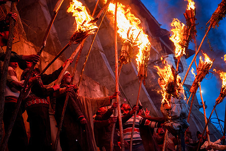 Kashmiri Muslims hold lit torches outside the cave shrine of Sakhi Zain-ud-din Wali, a Sufi saint, during an annual torch festival in Aishmuqam, 75 km (47 miles) south of Srinagar. Thousands of Muslim villagers in Indian-administered Kashmir gathered at a 15th-century Sufi saint's hilltop shrine for the annual torch festival, also known as the Zool Festival. Devotees lit wooden torches to honour the revered saint, marking the end of winter and the beginning of the paddy sowing season. Many believe this traditional torch festival commemorates the saint's victory over a demon that once terrorized local villagers. Flames illuminated the forested hillside as people paid obeisance at the mausoleum and took part in festivities that included traditional folk singing and musical performances.