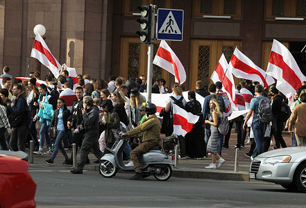 Participants carry historical white-red-white flags of Belarus during the rally.
Belarusian citizens living in Ukraine and Ukrainian activists took part in a rally to express their solidarity with the protests movement in Belarus against the results of the presidential elections.
