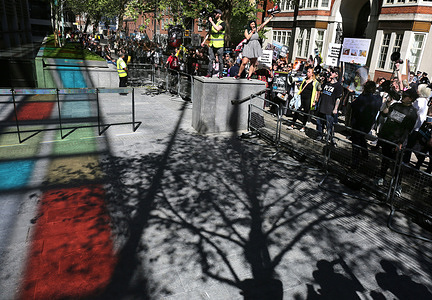 Protesters stand on a wall leading the chants outside the Home Office during the demonstration. The rally on World Day for Laboratory Animals is to further highlight the plight of thousands of animals kept and used for experimentation. Protesters believe that is cruel, the animals are being exploited and the rules governing vivisection are outdated and they are demanding the government outlaw whole practice.