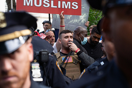 Pardoned Jan 6 rioter, Jake Lang outside of City Hall shouting to deport all Muslims. Demonstrators protested against Mayor Zohran Mamdani's attendance of the 25th anniversary of the 9/11 attack memorial service in downtown Manhattan.